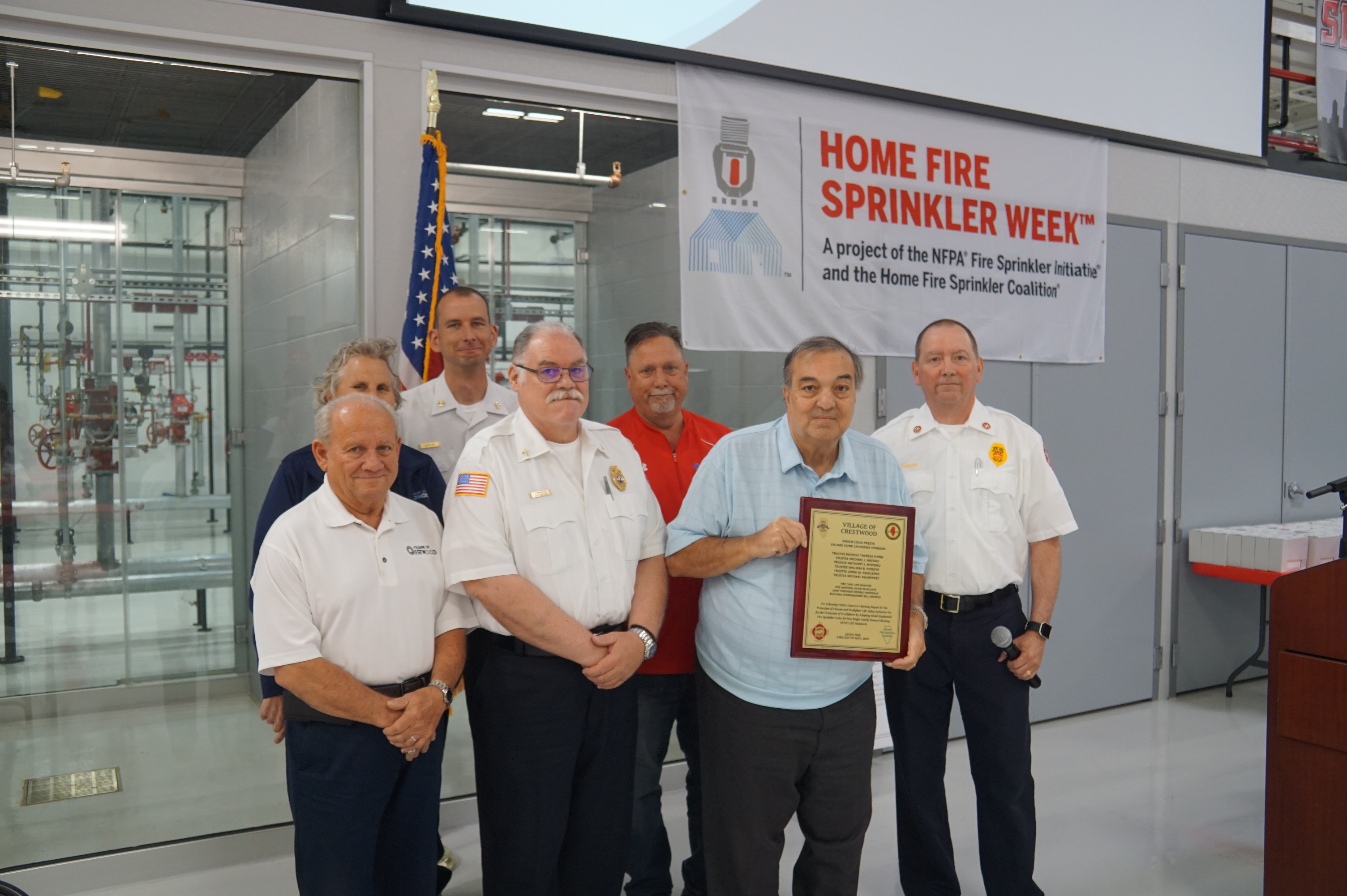 Crestwood Fire District recognition award presented to the Mayor Louis Presta, Fire Marshal Kevin McAuliffe, Village Trustees and Building Commissioner by Fire Marshal Dan Riordan of the Tinley Park FD.