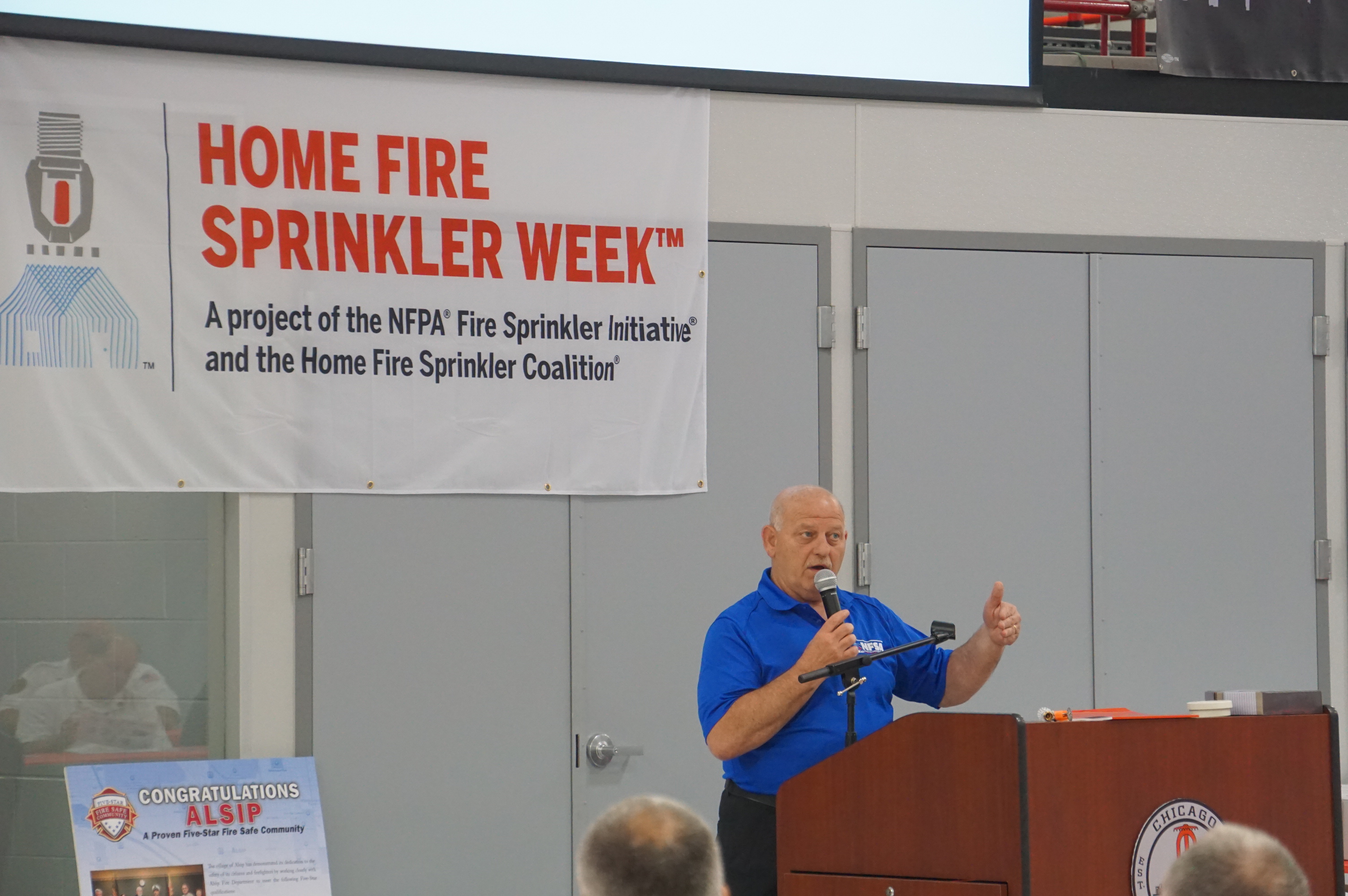 Bob Tinucci, Illinois Regional Manager with the National Fire Sprinkler Association – Illinois Chapter, read the recognition award for the Carol Stream Fire District.