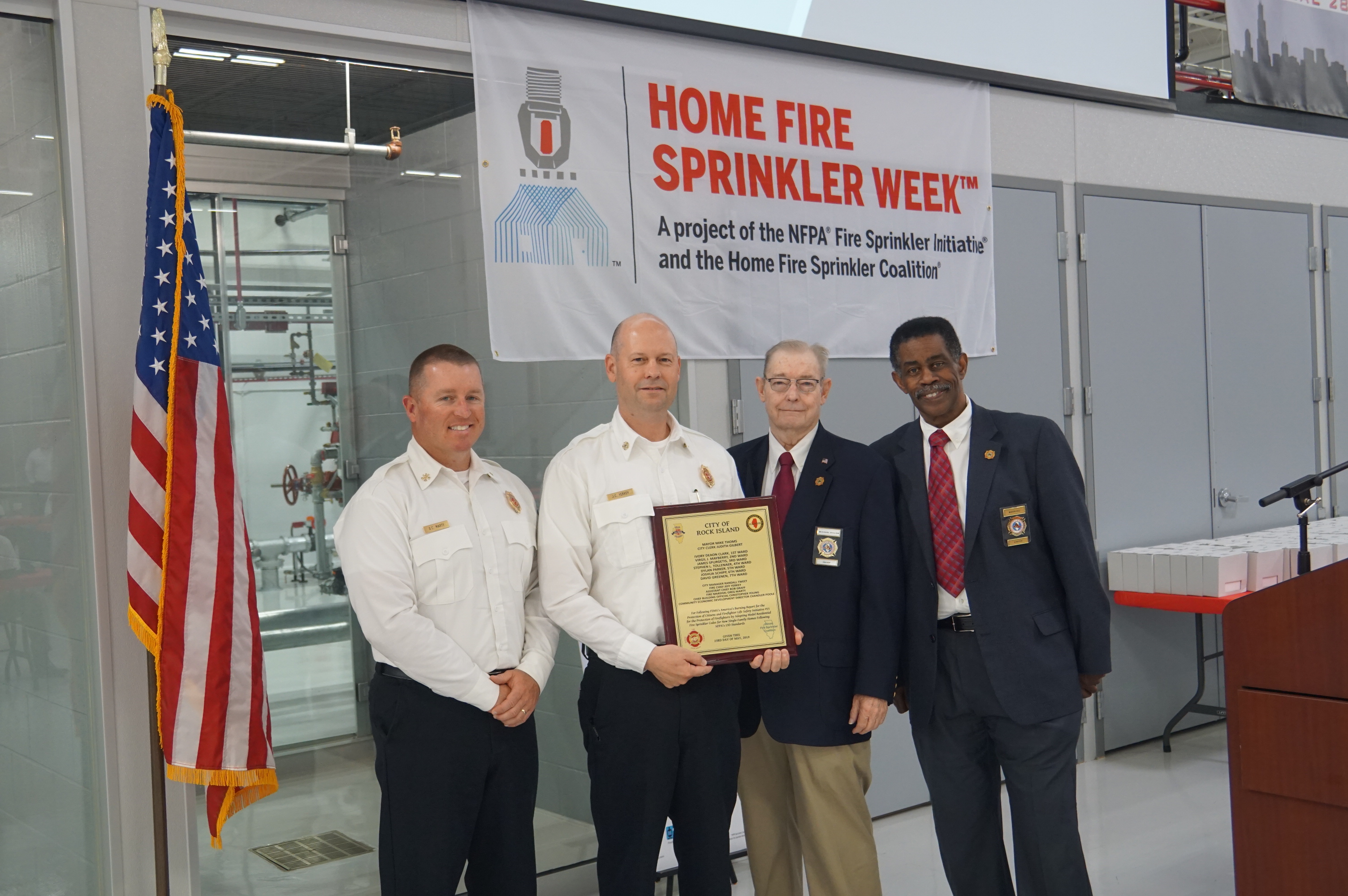 Rock Island Fire District recognition award presented to Fire Chief Jeff Yerkey and Fire Marshal Greg Marty by Director Marvin Hill (also a Trustee for the Barrington-Countryside Fire Protection District) and President Michael Dillon with the Illinois Association of Fire Protection Districts.