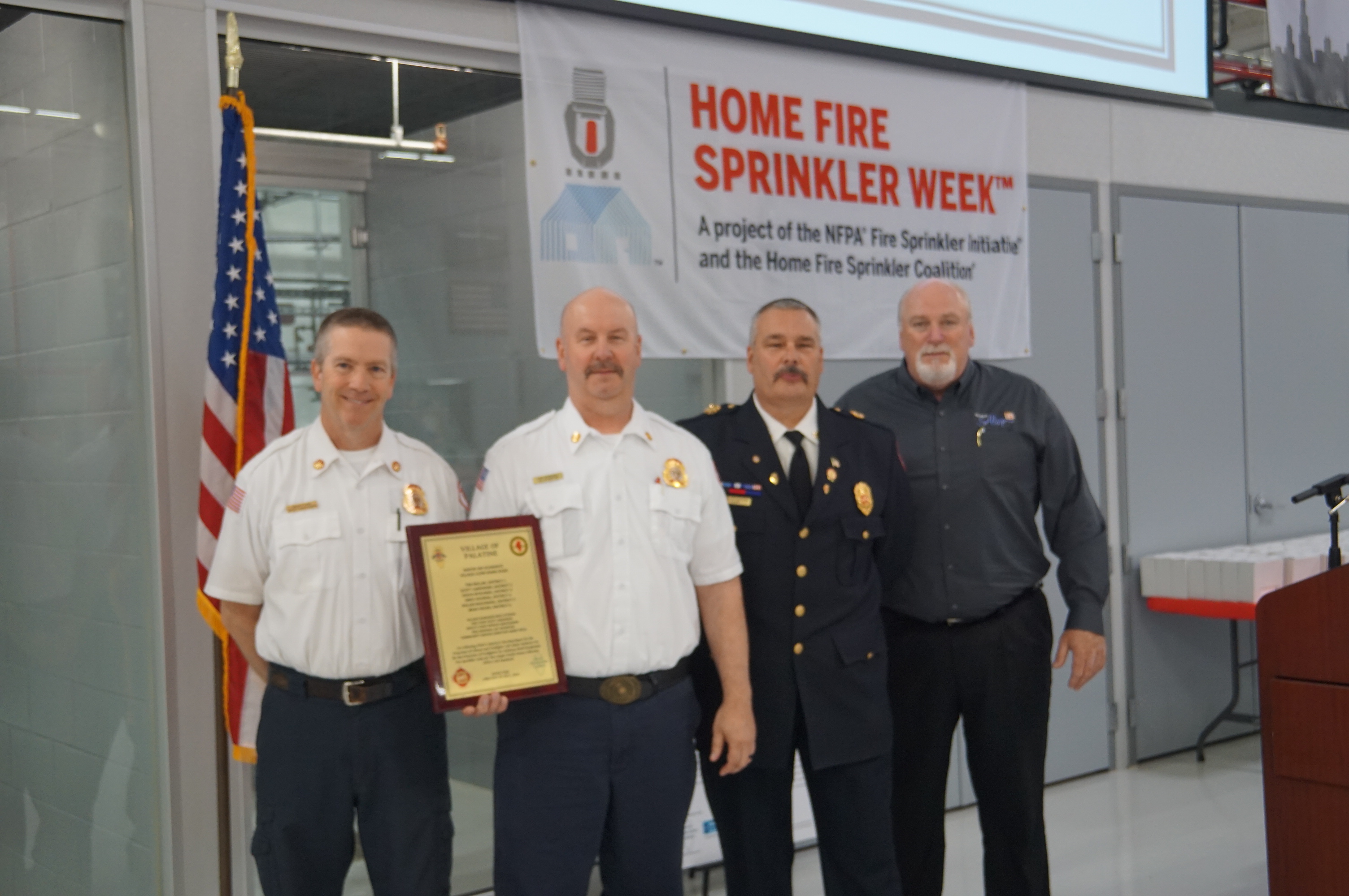 Palatine Fire Department recognition award presented to Chief of Administration Scott Mackeben and Fire Marshal Jay Atherton by Alsip Fire Chief Tom Styczynski and Alsip Mayor John Ryan.